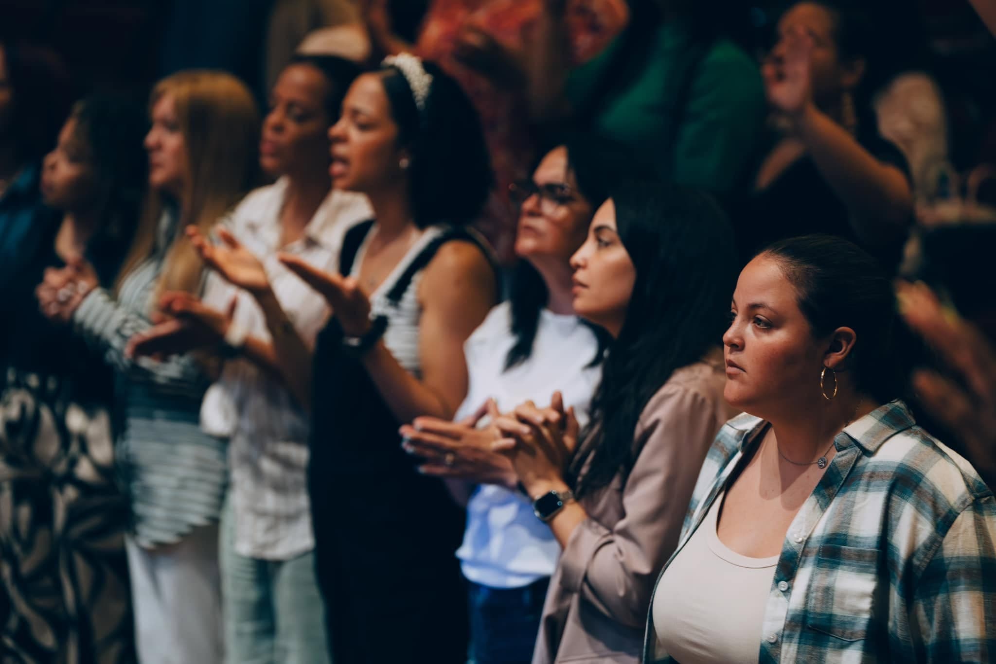 A row of women at a community gathering